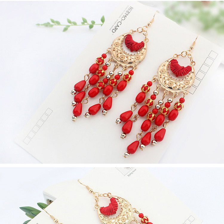 Ethnic style earrings female European and American elegant hand-made water drops tassel earrings Bohemian crescent-shaped earrings